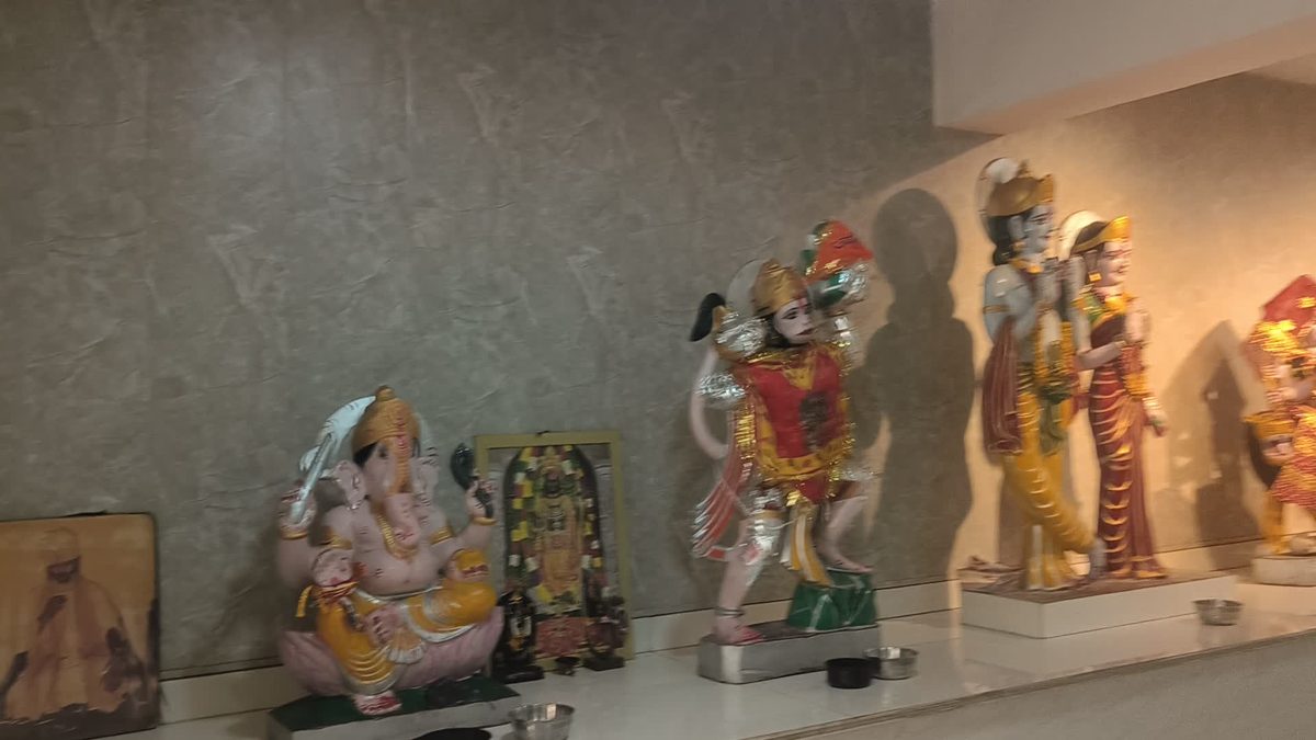 Row of decorated murtis of Shri Ganesh, Hanuman Ji and Shri Ram with Maa Sita inside the temple hall